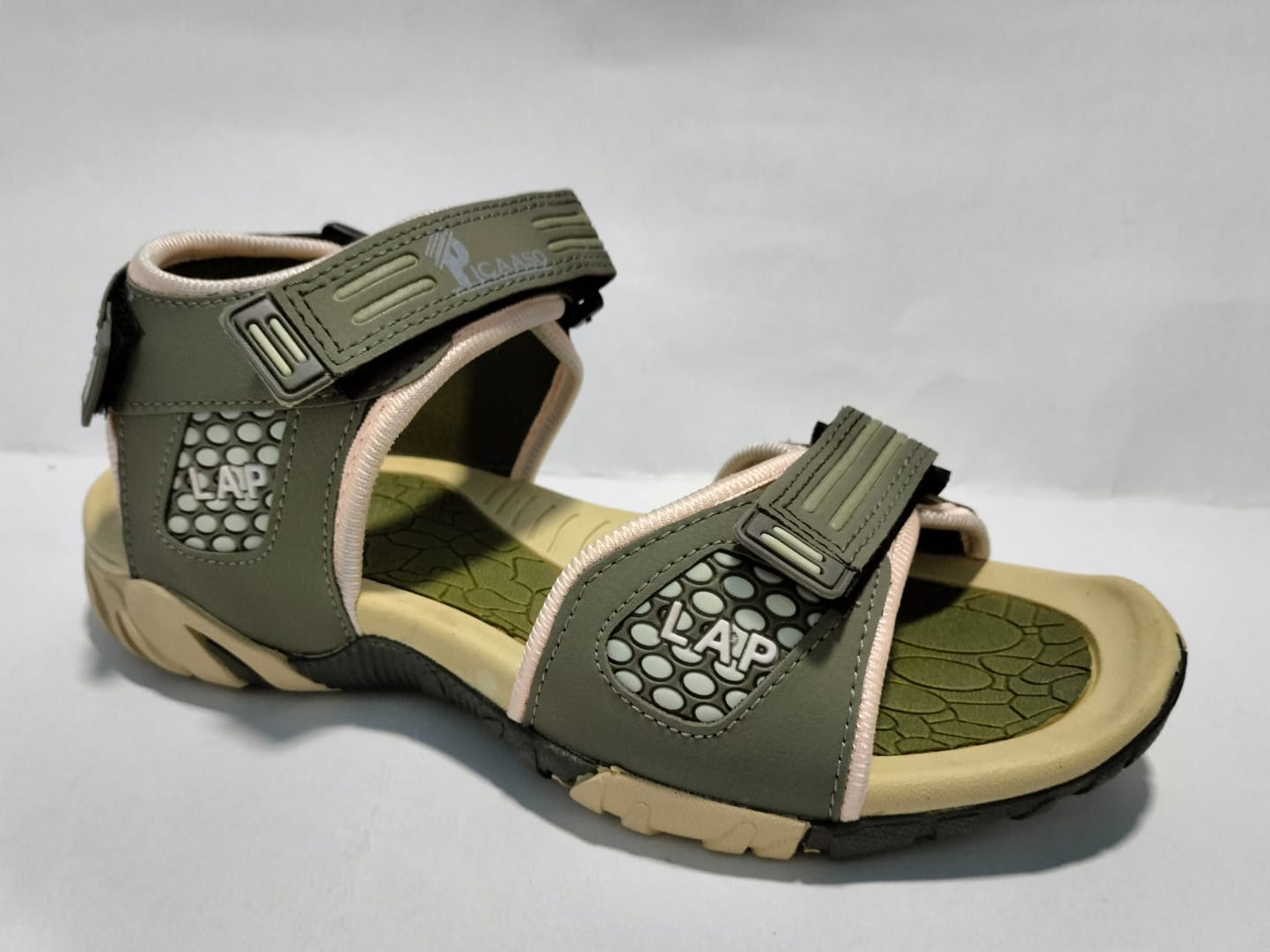 Green sandal with beige accents on a white background